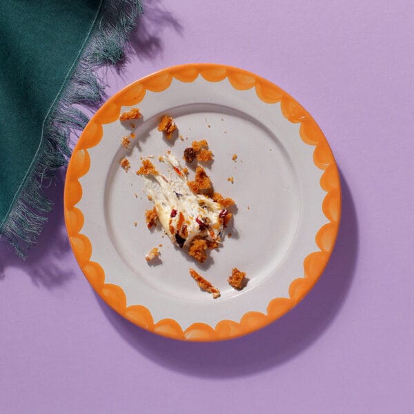 Carrot Cake crumbs and nothing else on a plate - overhead view.
