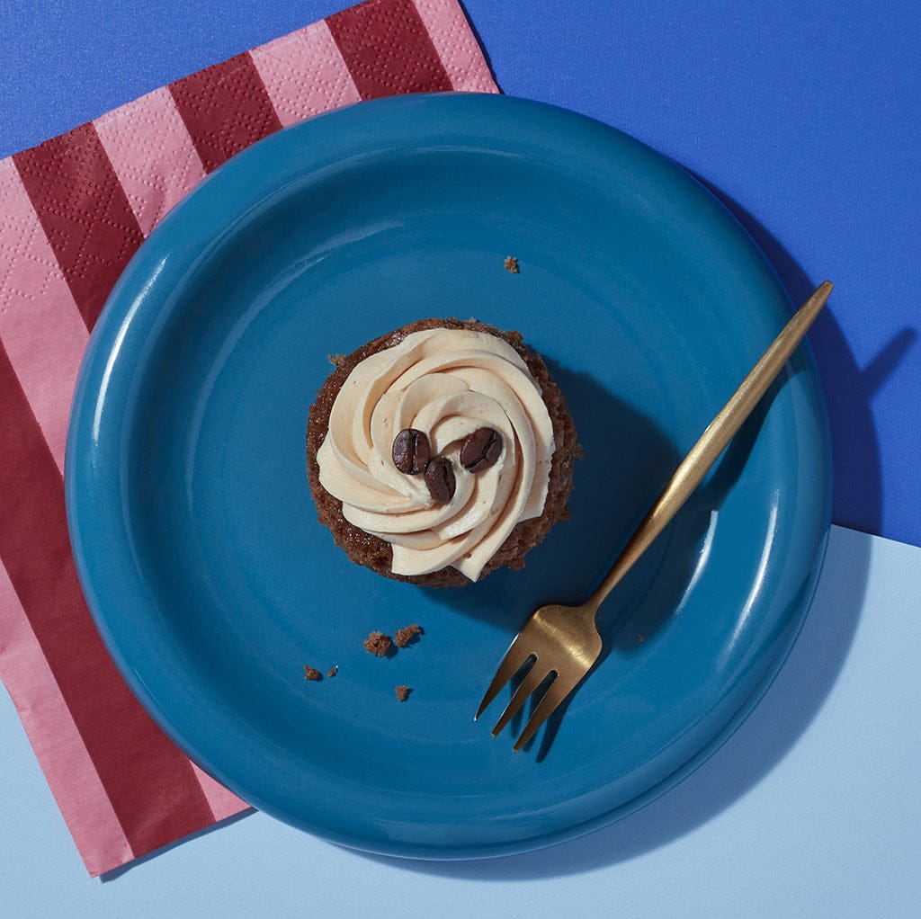 Overhead view of a Little Latte cupcake from CakeClub - a creamy frosting on top of a delicious coffee-flavoured treat.