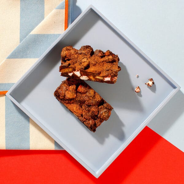 An overhead view of our Rocky Road traybake slices on a square grey plate.