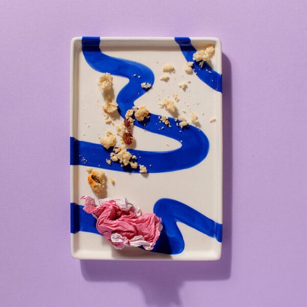 Cake Club The Big Sultana scone crumbs on a modern blue and white plate – finished and enjoyed.