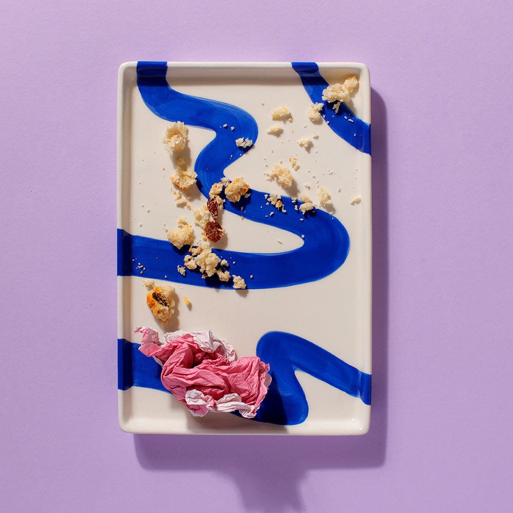 Cake Club The Big Sultana scone crumbs on a modern blue and white plate – finished and enjoyed.