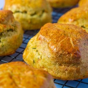 Close up of golden Spinach and Feta Scones cooling on a rack.