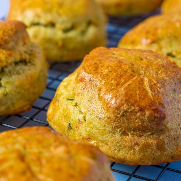 Close up of golden Spinach and Feta Scones cooling on a rack.